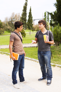 two young student talking at the school (selective focus)